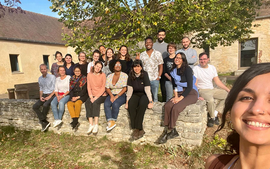 Photo shows the participants in the Community of Practice retreat, smiling and looking to the camera, in the style of a selfie.